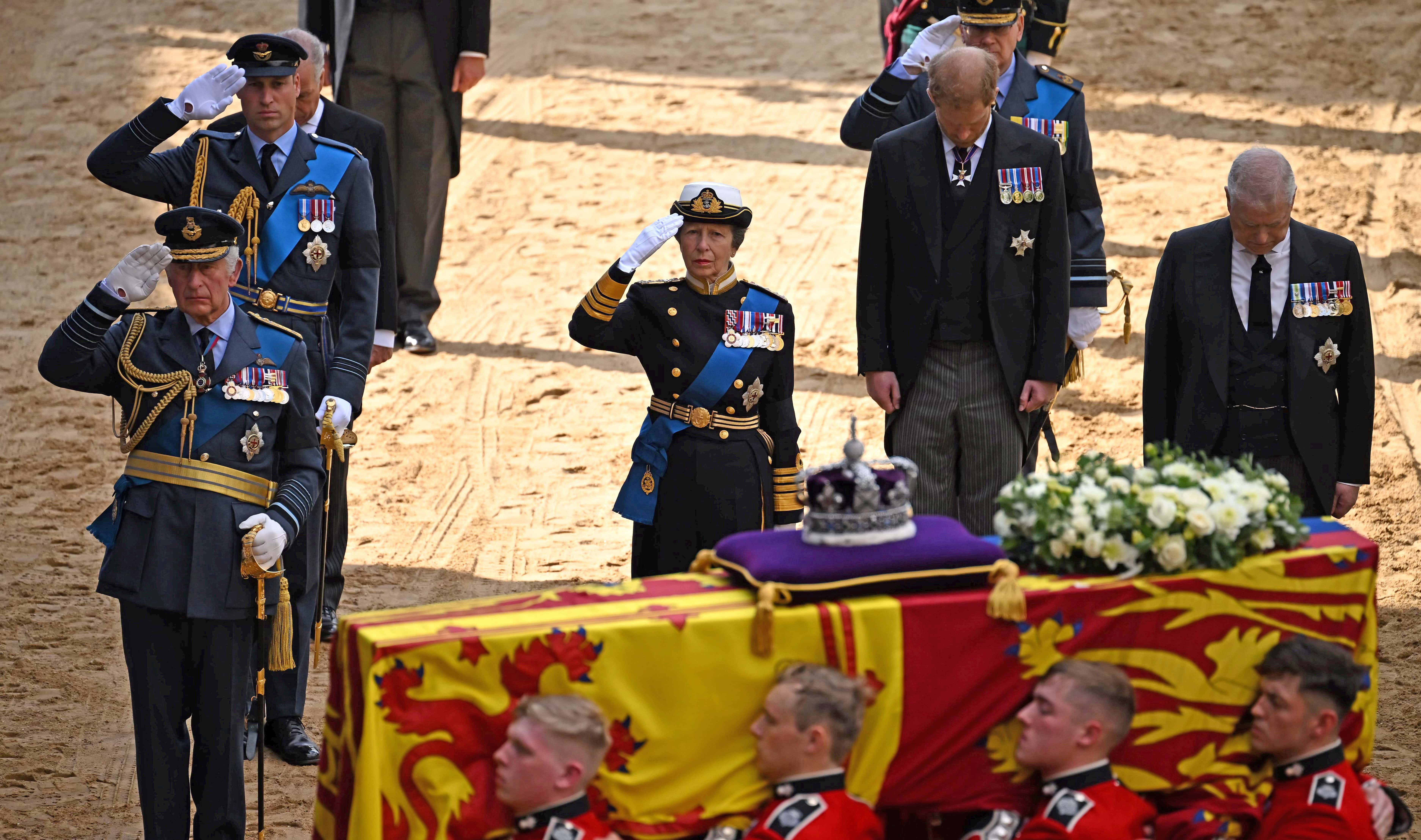 King Charles III, Prince William, Prince of Wales, Princess Anne, Princess Royal, Prince Harry, Duke of York and Prince Andrew, Duke of York follow the coffin of Queen Elizabeth II, adorned with a Royal Standard and the Imperial State Crown, arrives at the Palace of Westminster, following a procession from Buckingham Palace on September 14, 2022 in London, United Kingdom. Queen Elizabeth II's coffin is taken in procession on a Gun Carriage of The King's Troop Royal Horse Artillery from Buckingham Palace to Westminster Hall where she will lay in state until the early morning of her funeral. Queen Elizabeth II died at Balmoral Castle in Scotland on September 8, 2022, and is succeeded by her eldest son, King Charles III.