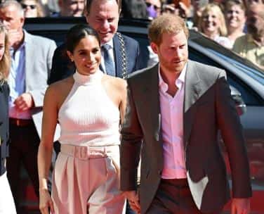 Meghan Markle was seen walking hand-in-hand in Germany ( Sussex Squad/Twitter)