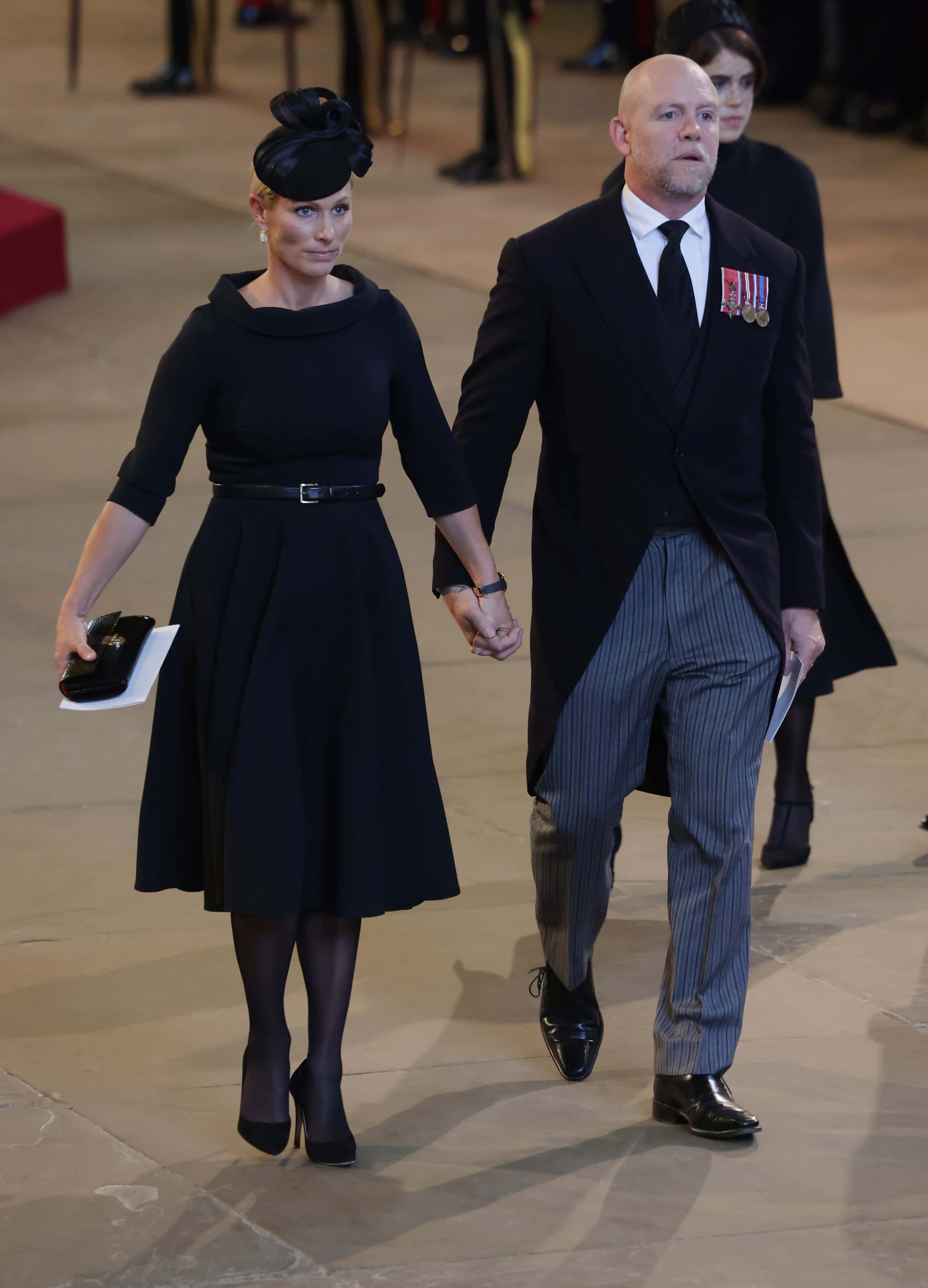 Zara Tindal and Mike Tindall leave Westminster Hall on September 14, 2022 in London, United Kingdom. Queen Elizabeth II's coffin is taken in procession on a Gun Carriage of The King's Troop Royal Horse Artillery from Buckingham Palace to Westminster Hall where she will lay in state until the early morning of her funeral. Queen Elizabeth II died at Balmoral Castle in Scotland on September 8, 2022, and is succeeded by her eldest son, King Charles III. (Photo by Ian Vogler - WPA Pool/Getty Images)