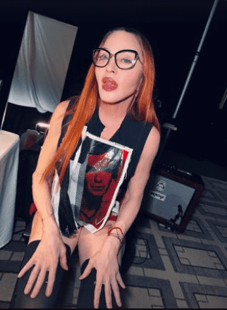 The Queen of Pop was dressed in a ragged black tank top with a red-and-white illustration stitched over the chest (madonna/Instagram)