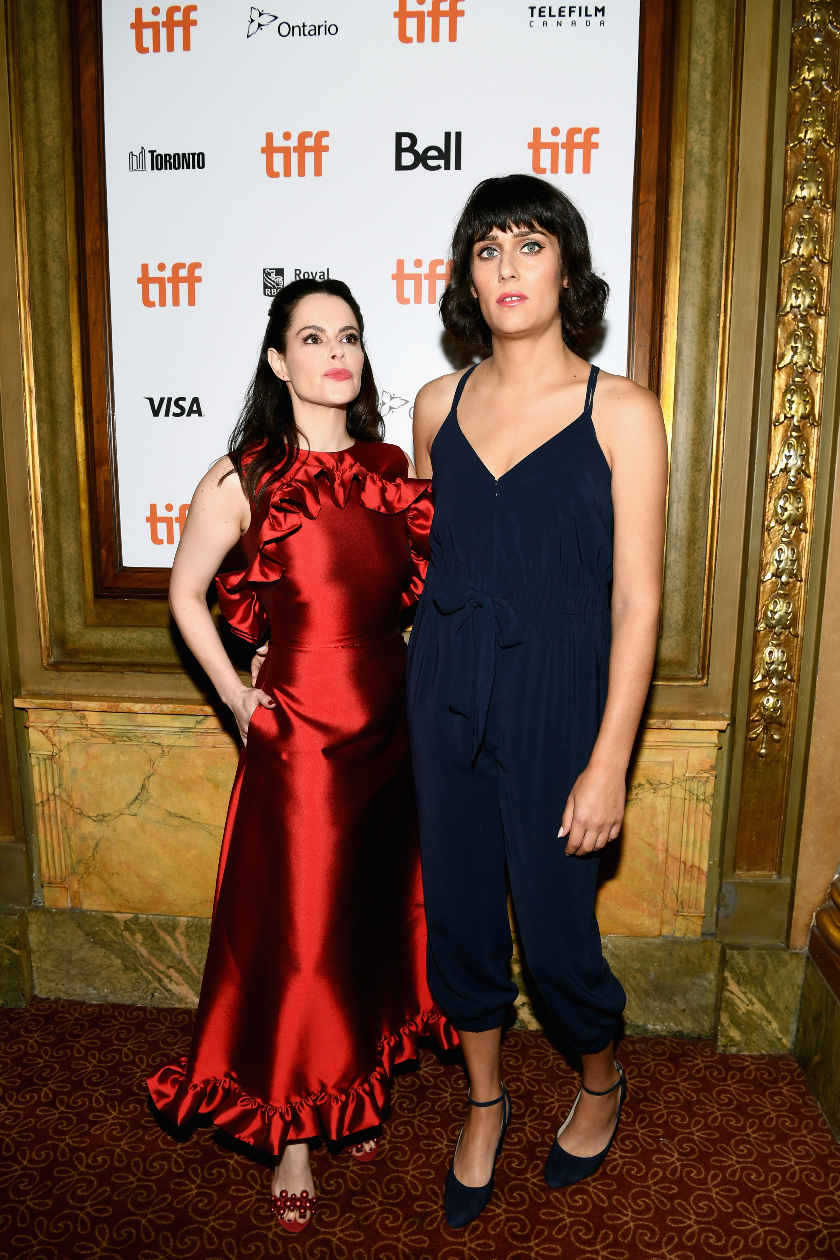 Emily Hampshire (L) and Teddy Geiger attend the 'The Death And Life Of John F. Donovan' premiere during 2018 Toronto International Film Festival at Winter Garden Theatre on September 10, 2018 in Toronto, Canada.