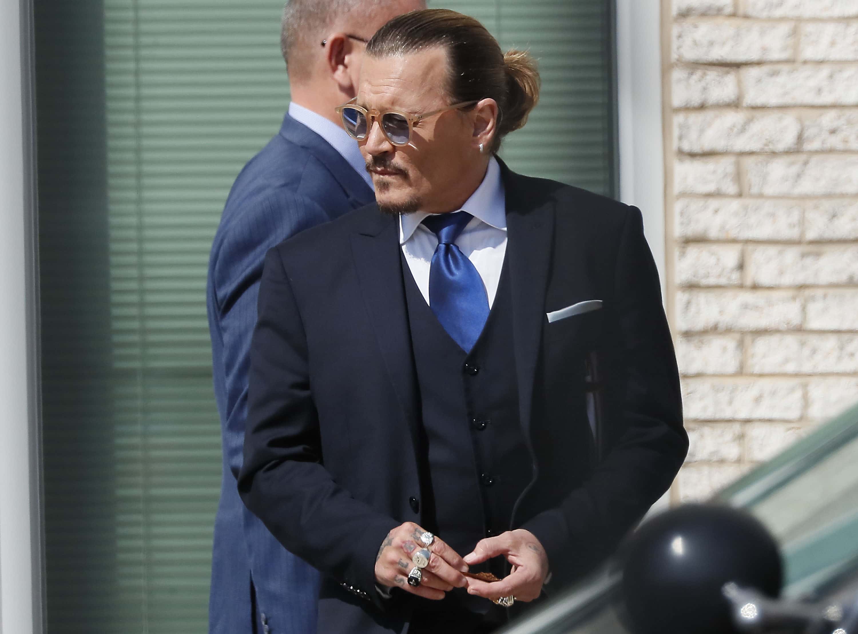 FAIRFAX, VIRGINIA - APRIL 25: Johnny Depp steps outside court during his civil trial at Fairfax Coun