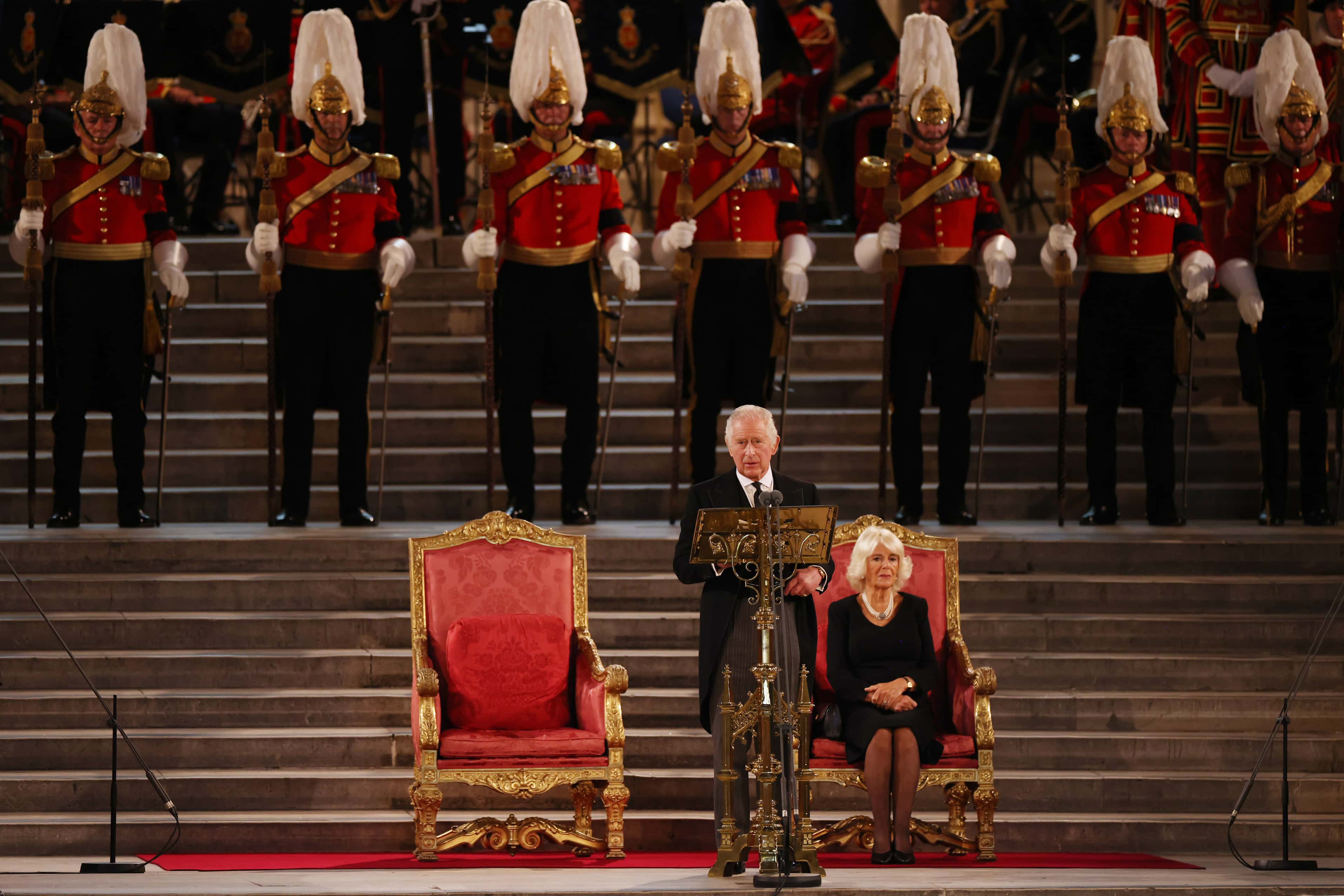 King Charles III takes part in an address as Camilla, Queen Consort looks on in Westminster Hall on September 12, 2022 in London, England. The Lord Speaker and the Speaker of the House of Commons presented an Address to His Majesty on behalf of their respective House in Westminster Hall following the death of Her Majesty Queen Elizabeth II. The King replied to the Addresses. Queen Elizabeth II died at Balmoral Castle in Scotland on September 8, 2022, and is succeeded by her eldest son, King Charles III. (Photo by Dan Kitwood/Getty Images)