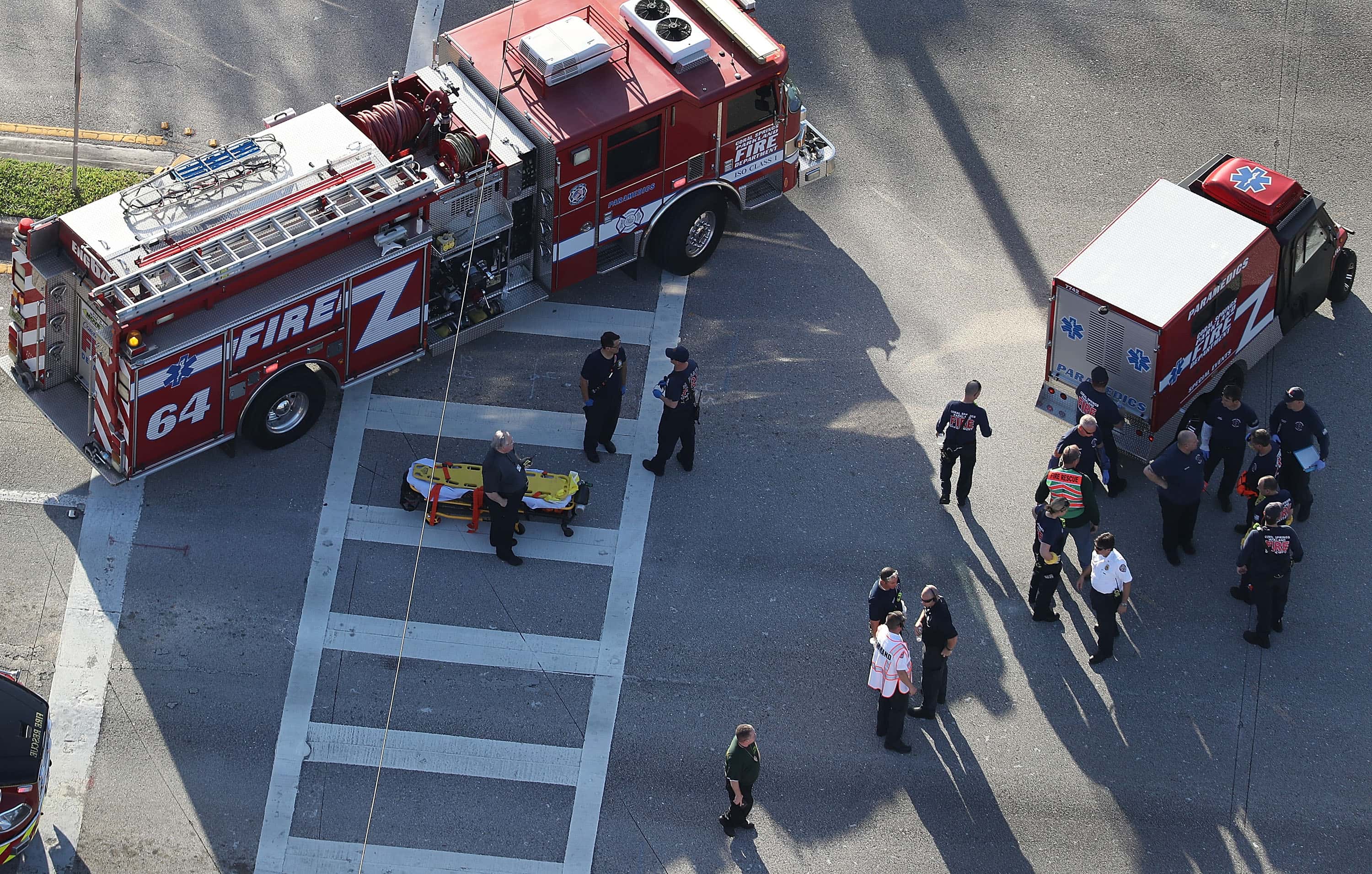 Fire Rescue personnel work the scene at the Marjory Stoneman Douglas High School after a shooting at the school that reportedly killed and injured multiple people on February 14, 2018 in Parkland, Florida. Numerous law enforcement officials continue to investigate the scene.