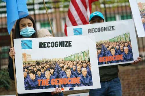 Supporters of the East Turkistan National Awakening Movement rally in front of the British Embassy ahead of an April 22 vote in the British House of Commons on whether or not to declare that a genocide is underway in Xinjiang province and Chinas treatment of the Uyghur Muslims on April 16, 2021 in Washington, DC. The group is calling for Uyghurs and other Turkic people fleeing Xinjiang to be granted refugee status and calling for an international boycott of the 2022 Winter Olympic Games in Beijing, China. (Photo by Drew Angerer/Getty Images)