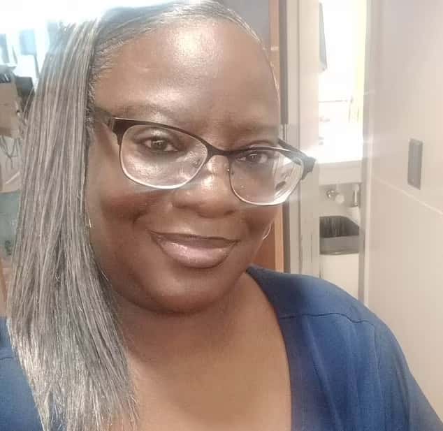 Juanita Gray is seen hurt on the floor and a cop tells her, 'Ma'am we have an ambulance coming' (FB)