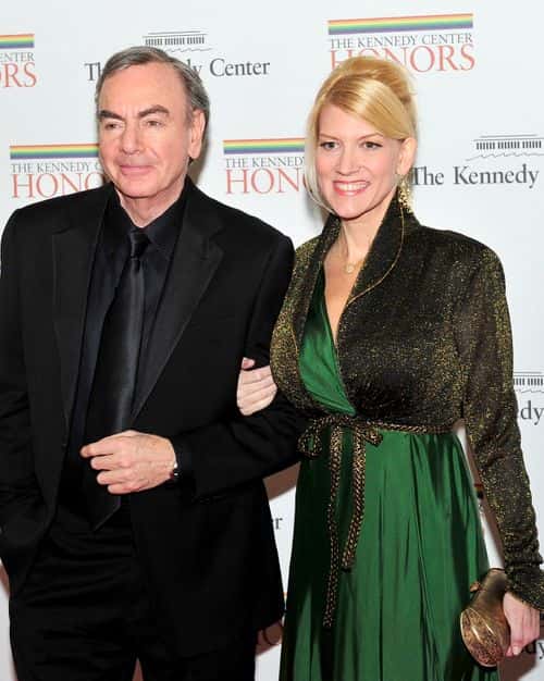 (AFP OUT) Neil Diamond and Katie McNeil arrive for the formal Artist's Dinner honoring the recipients of the 2011 Kennedy Center Honors hosted by United States Secretary of State Hillary Rodham Clinton at the U.S. Department of State December 3, 2011 in Washington, DC. President Barack Obama will host the five recipients of the 34th Kennedy Center Honors at a White House reception Sunday before attending the evening gala at the John F. Kennedy Center for the Performing Arts. The 2011 honorees are actress Meryl Streep, singer Neil Diamond, actress Barbara Cook, musician Yo-Yo Ma, and musician Sonny Rollins..