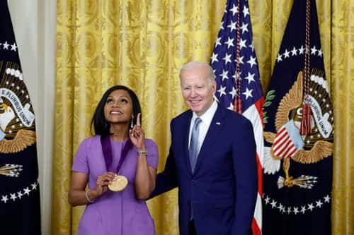 U.S. President Joe Biden awards actress Mindy Kaling a 2021 National Medal of Art during a ceremony in the East Room of the White House on March 21, 2023 in Washington, DC. The awards ceremony is the first for Biden, who was delayed in hosting the the awards at the time due to the pandemic.