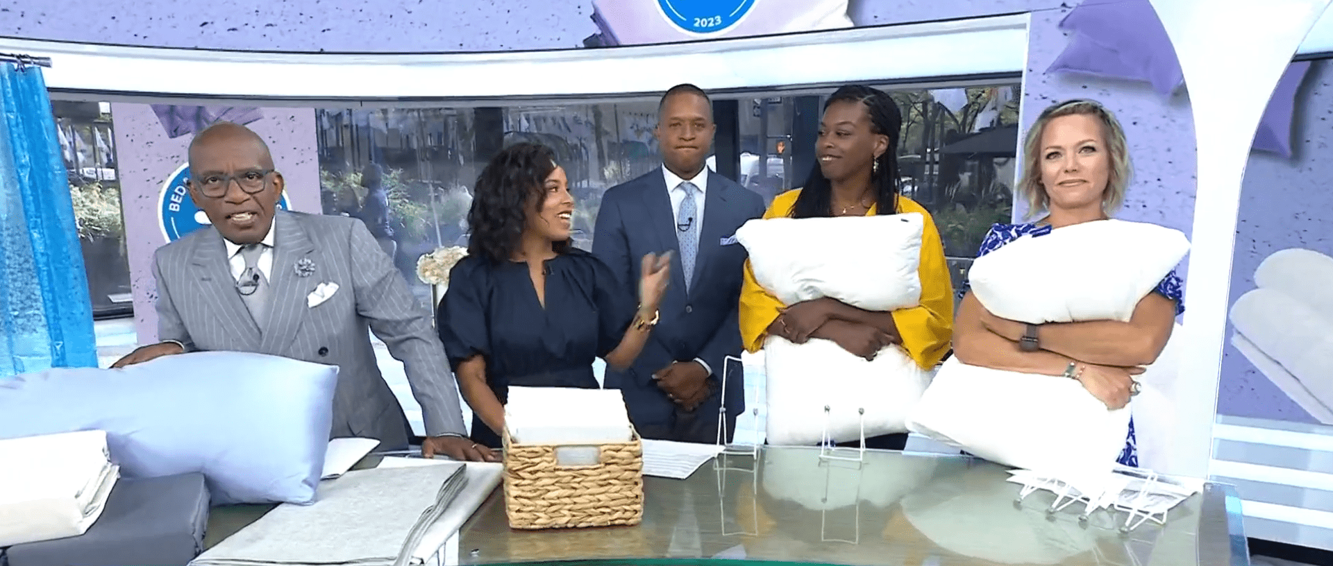 Craig Melvin stops playing with the pillows and stands behind the hosts as Al Roker ends the segment (Twitter/@TODAYshow)