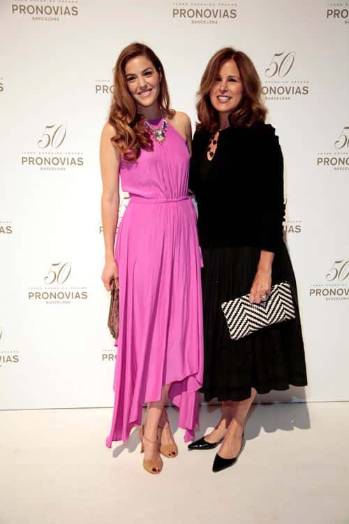 (L-R) Lily Costner and Cindy Silva pose during a photocall for the Pronovia's 50th anniversary bridal fashion show during 'Barcelona Bridal Week 2014'on May 9, 2014 in Barcelona, Spain.