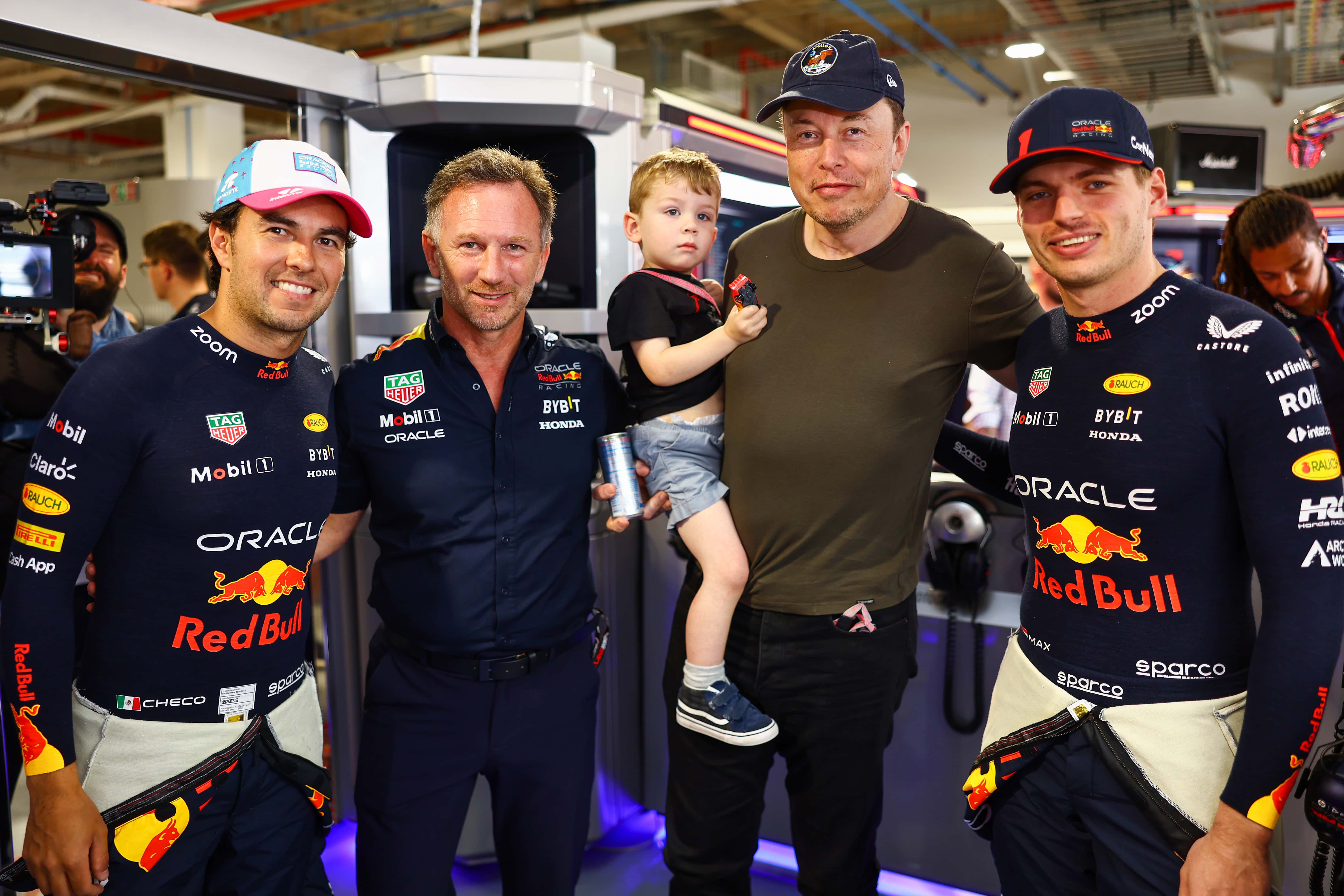 Sergio Perez of Mexico and Oracle Red Bull Racing, Red Bull Racing Team Principal Christian Horner, Elon Musk and Max Verstappen of the Netherlands and Oracle Red Bull Racing pose for a photo in the Red Bull Racing garage prior to final practice ahead of the F1 Grand Prix of Miami at Miami International Autodrome on May 06, 2023 in Miami, Florida.