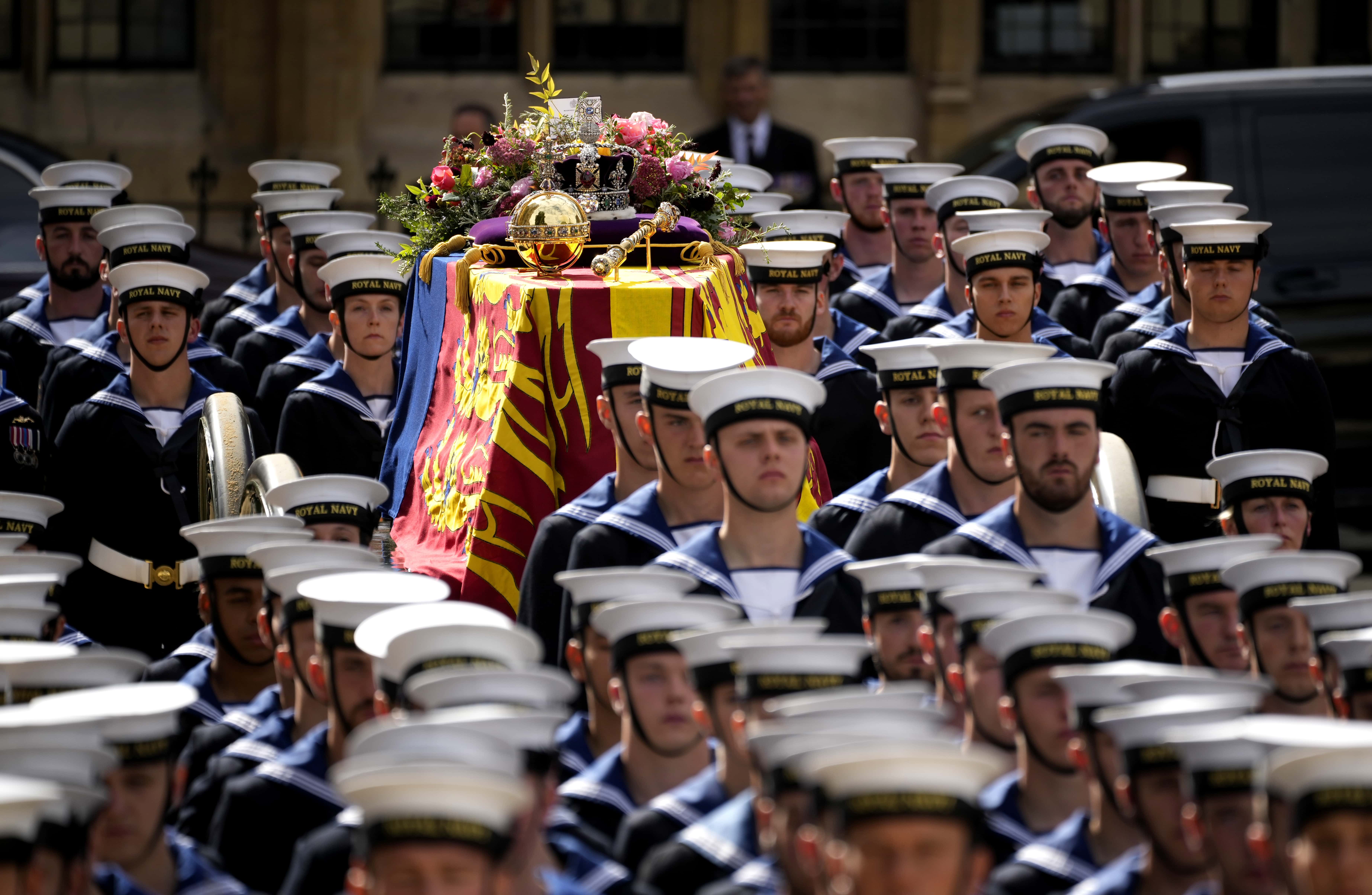The Royal Navy carry the coffin on a State Gun Carriage in the procession after the State funeral of Queen Elizabeth II on September 19, 2022 in London, England. Elizabeth Alexandra Mary Windsor was born in Bruton Street, Mayfair, London on 21 April 1926. She married Prince Philip in 1947 and ascended the throne of the United Kingdom and Commonwealth on 6 February 1952 after the death of her Father, King George VI. Queen Elizabeth II died at Balmoral Castle in Scotland on September 8, 2022, and is succeeded by her eldest son, King Charles III. (Photo by Christopher Furlong/Getty Images)