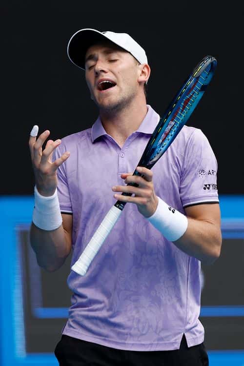 Casper Ruud of Norway reacts in their round two singles match against Jenson Brooksby of the United States during day four of the 2023 Australian Open at Melbourne Park on January 19, 2023 in Melbourne, Australia.