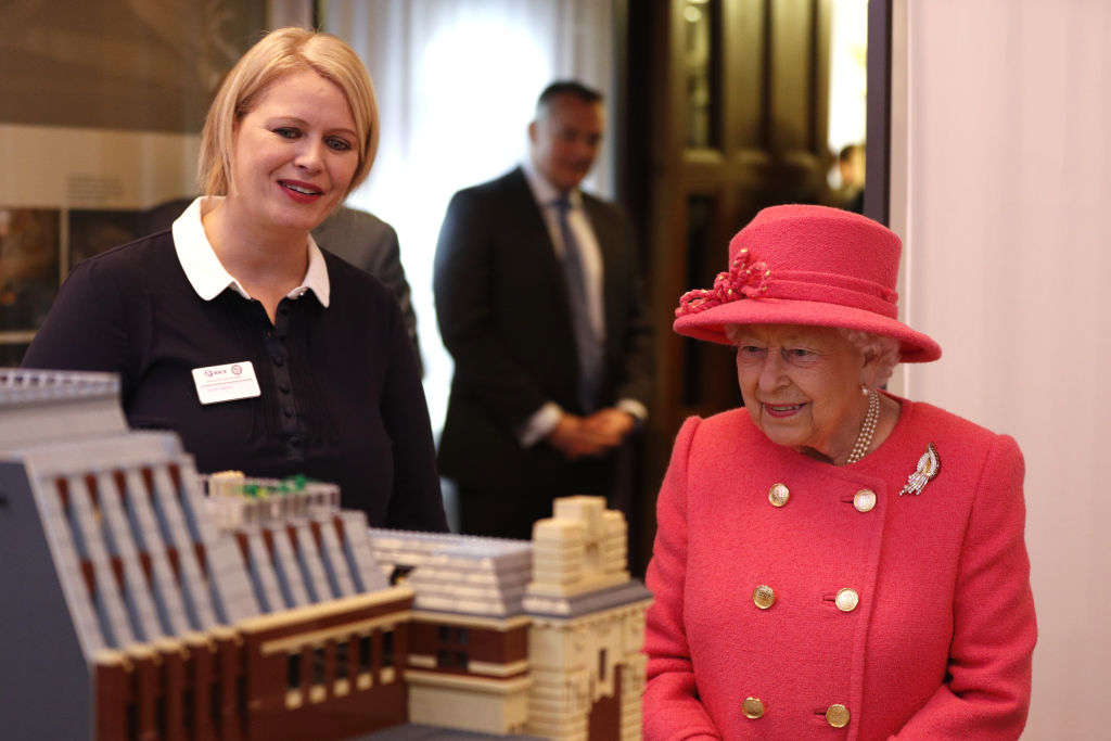 Queen Elizabeth II views a model of the building as she visits the Royal Insitute of Chartered Surveyors (RICS) to mark its 150th anniversary on November 20, 2018, in London, England. (Getty Images)