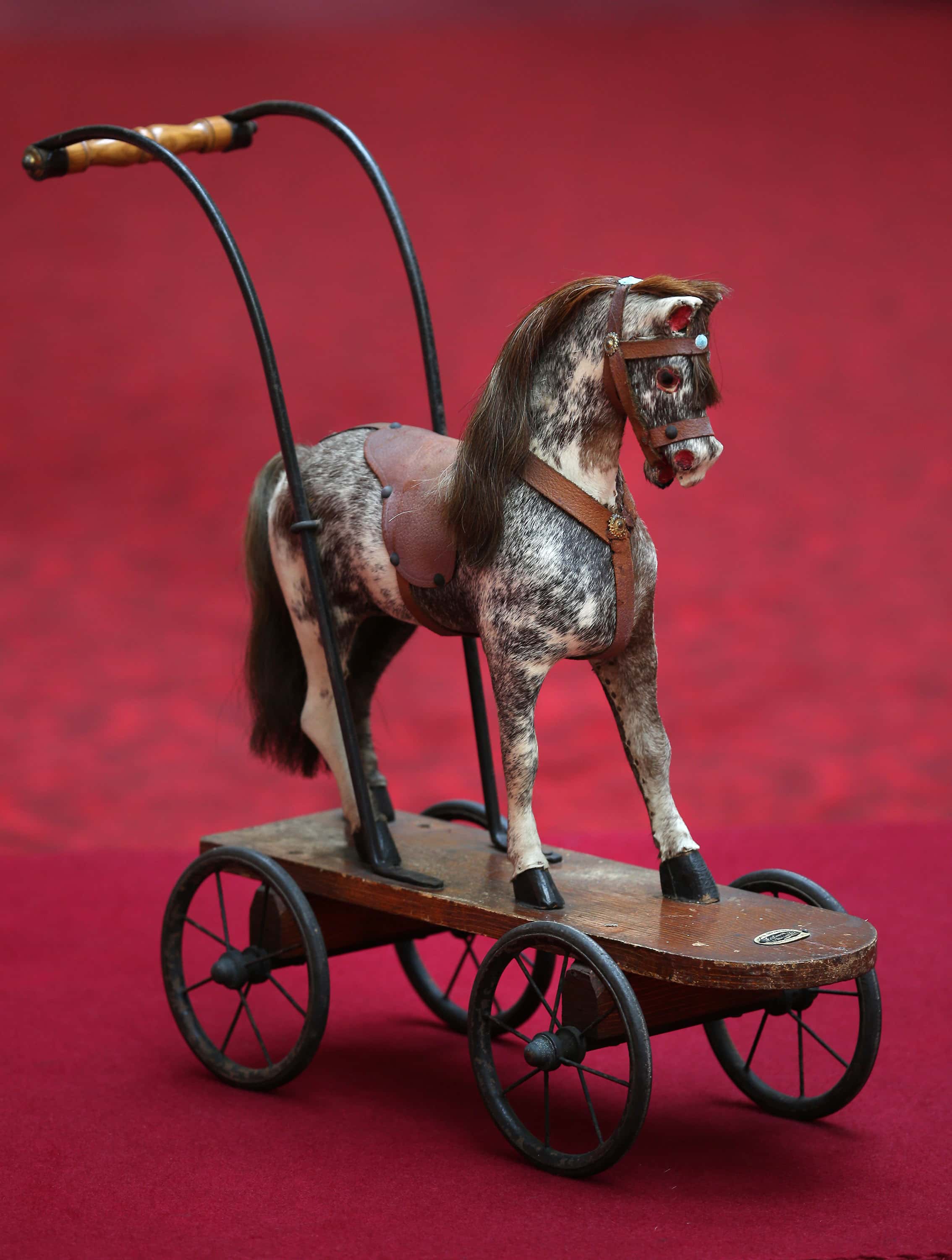 A toy horse belonging to Queen Elizabeth II is displayed at Buckingham Palace ahead of the Royal Childhood exhibition on April 2, 2014 in London, England. Spanning more than 250 years the exhibition brings together objects from the Royal Collection, the Royal Archives and the private collections of members of the Royal Family, as well as previously unseen photographs and film footage. Royal Childhood is part the Summer Opening of the State Rooms at Buckingham Palace from July 26, 2014 to September 28, 2014.