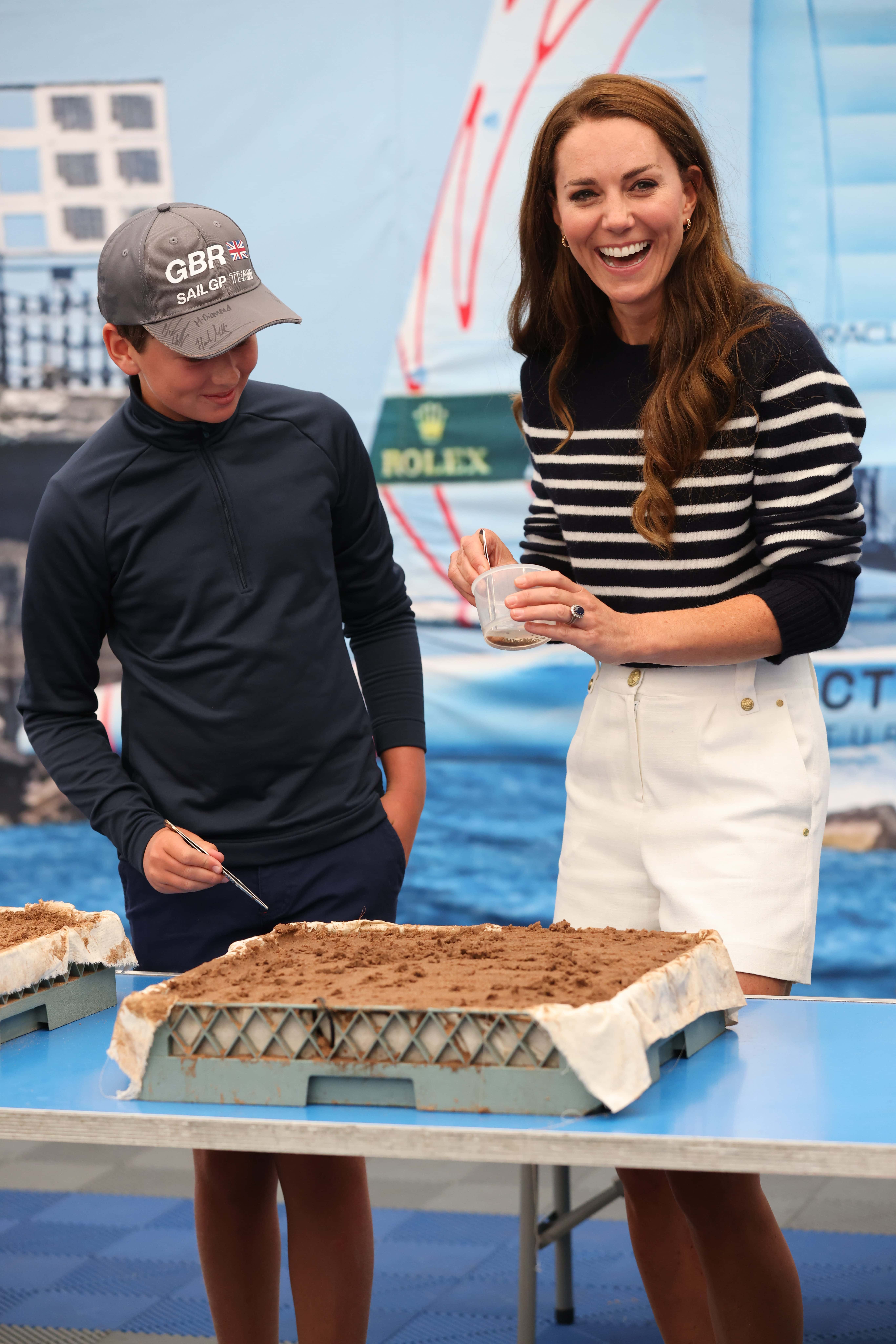Catherine, Duchess Of Cambridge (R), takes parts in activities as she visits the 1851 Trust and the Great Britain SailGP Team at Trinity Pier on July 31, 2022 in Plymouth, England. During the visit, the Duchess of Cambridge took part in activities educating young people about sustainability. (Photo by Jeff Gilbert - WPA Pool/Getty Images)