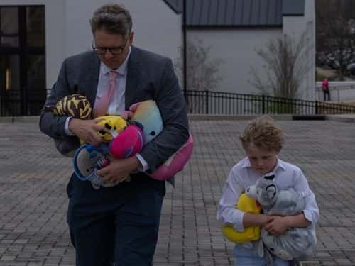 A father and his son leave Woodmont Christian Church after attending the Funeral service of nine-year-old Evelyn Dieckhaus on March 31, 2023 in Nashville, Tennessee. A 28-year-old former student of the private Covenant School in Nashville, wielding a handgun and two AR-style weapons, shot and killed three 9-year-old students and three adults before being killed by responding police officers on March 27th.
