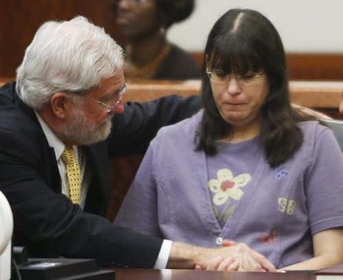 Andrea Yates (R) sits with her attorney George Parnham after the not guilty by reason of insanity verdict was read in her retrial July 26, 2006 in Houston. Yates admitted to drowning her five children in a bath tub in 2001 and pleaded guilty by reason of insanity. (Photo by Brett Coomer-Pool/Getty Images)