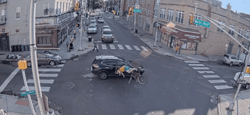 Amy DeGise's SUV hit the cyclist, sending him flying onto the hood of her car  (@HeinisHardNews/twitter)