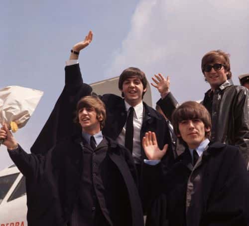 The Beatles, John Lennon, George Harrison (1943 - 2001), Paul McCartney and Ringo Starr, pictured on their arrival in London  following a tour of Australia.