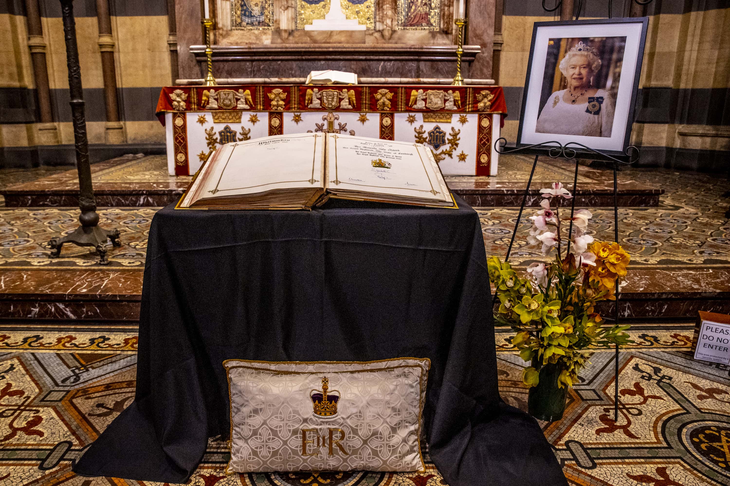 A High Alter tribute to Queen Elizabeth is shown at St. Patricks Cathedral on September 09, 2022 in Melbourne, Australia. Queen Elizabeth II died at Balmoral Castle in Scotland aged 96 on September 8, 2022, and is survived by her four children, Charles, Prince of Wales, Anne, Princess Royal, Andrew, Duke Of York and Edward, Duke of Wessex. Elizabeth Alexandra Mary Windsor was born in Bruton Street, Mayfair, London on 21 April 1926. She married Prince Philip in 1947 and acceded the throne of the United Kingdom and Commonwealth on 6 February 1952 after the death of her Father, King George VI. Queen Elizabeth II was the United Kingdom's longest-serving monarch. (Photo by Sam Tabone/Getty Images)