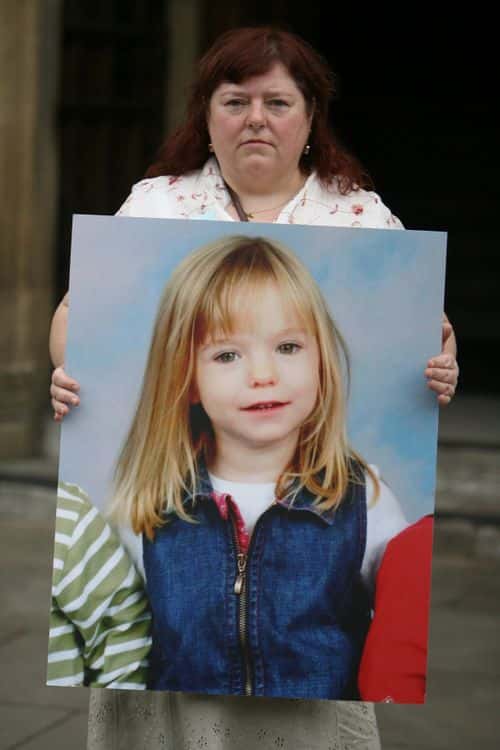 Phil McCann carries a picture of her missing niece Madeleine McCann as she visits Parliament on May 16, 2007 in London. Madeleine McCann disappeared from a holiday complex in Praia da Luz 13 days ago. (Photo by Matt Cardy/Getty Images)