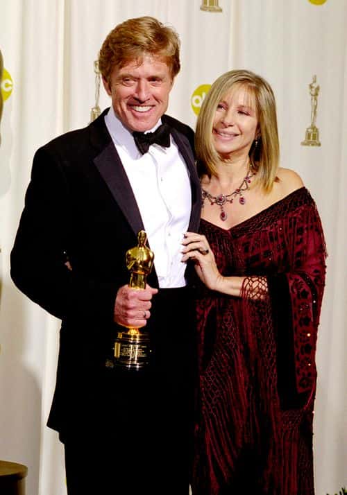 Oscar Winner Robert Redford Poses For A Photograph With Actress Barbra Streisand After He Received An Honorary Award From The Board Of Governors Of The Academy Of Motion Picture Arts And Sciences, Backstage At The 74Th Annual Academy Awards March 24, 2002 At The Kodak Theater In Hollywood, Ca.
