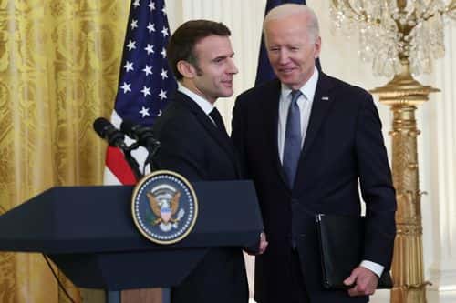 U.S. President Joe Biden and French President Emmanuel Macron shake hands following a joint press conference at the White House during an official state visit on December 01, 2022 in Washington, DC. President Biden is welcoming Macron for the first official state visit of the Biden administration. (Photo by Kevin Dietsch/Getty Images)