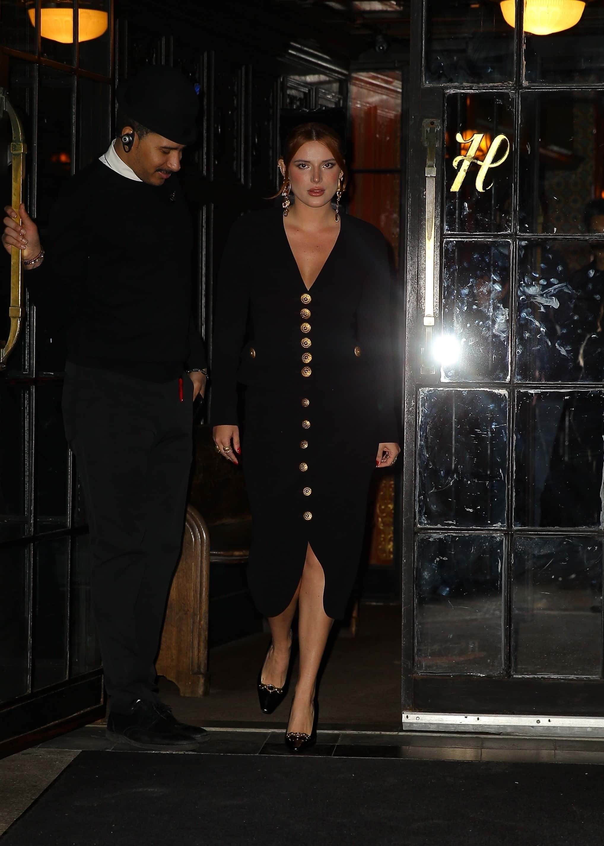 Bella appeared to be in her element as she stopped to pose for the cameras outside of the hotel (Backgrid)

