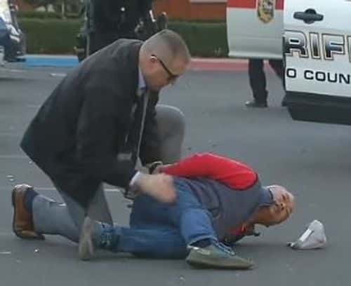 Zhao Chunli getting arrested by police (ABC 7)