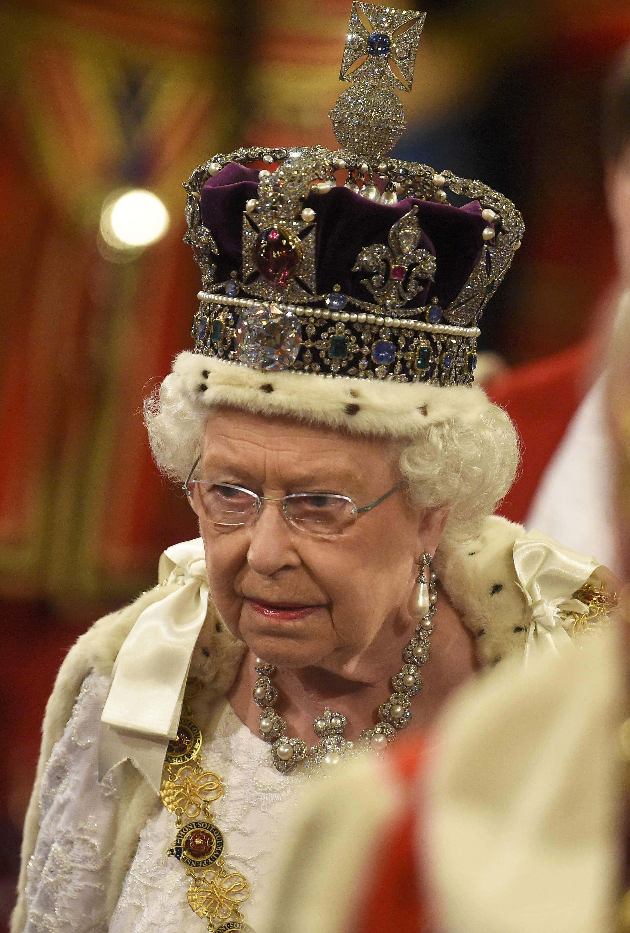 Queen Elizabeth II proceeds through the Royal Gallery before the State Opening of Parliament in the House of Lords at the Palace of Westminster on May 18, 2016 in London, England. The State Opening of Parliament is the formal start of the parliamentary year. This year's Queen's Speech, setting out the government's agenda for the coming session, is expected to outline policy on prison reform, tuition fee rises and reveal the potential site of a UK spaceport.
