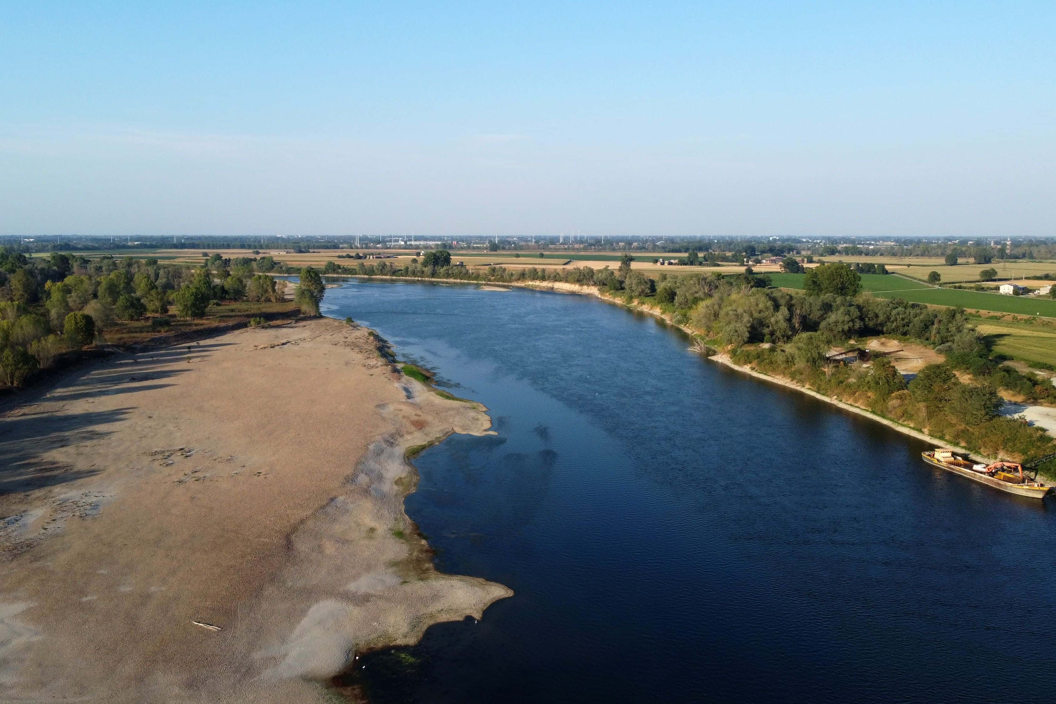 In this aerial photo, the Po river flows in Calendasco on July 18, 2022 in Piacenza, Italy. A state of emergency was declared in five northern regions amid a worsening drought, as Italy experiences an early heatwave and a lack of rainfall.