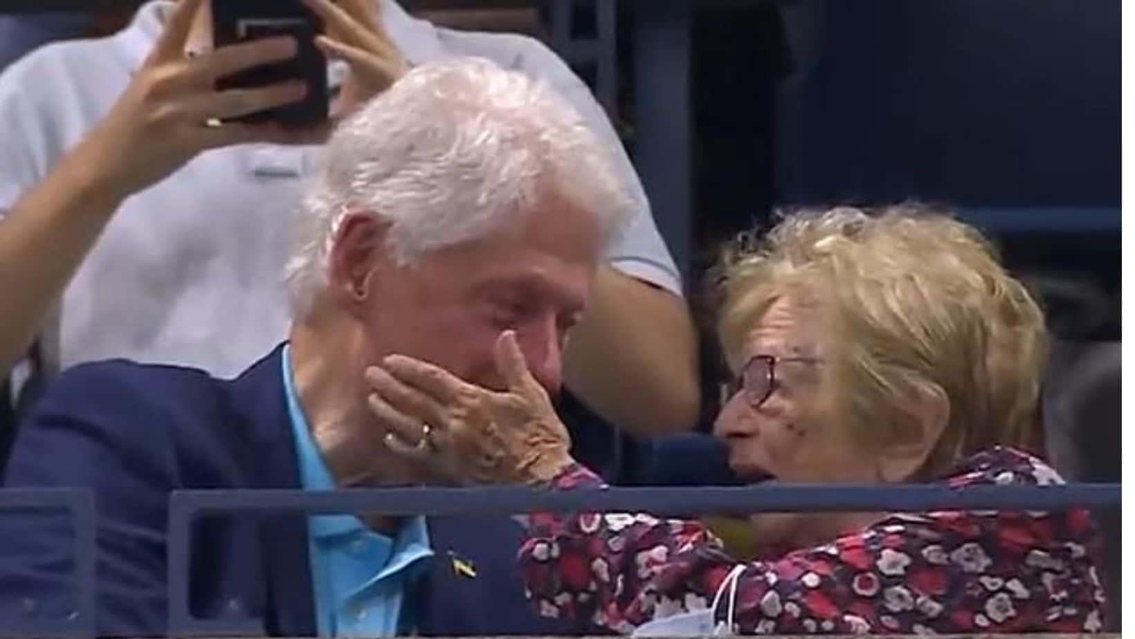 Dr. Ruth taps Bill Clinton on the cheek. (Photo via Twitter)