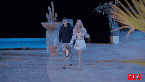Kelle Mortensen and Jose walking hand in hand in 'MILF Manor' (TLC)