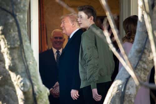 (L-R) Vice President Mike Pence talks with US President Donald Trump as Barron Trump looks on as they exit the Oval Office at the White House on January 17, 2020 in Washington, DC. The Trump family is headed to Mar-a-Lago for the weekend.