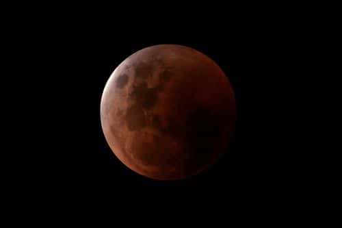 A lunar eclipse is seen in Sydney on November 08, 2022 in Sydney, Australia. Australians will experience the first visible total lunar eclipse of the year on Tuesday, with the eclipse also being visible from New Zealand. (Photo by Brook Mitchell/Getty Images)