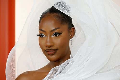 TEMS in her elaborate headgear (Photo by Mike Coppola/Getty Images)