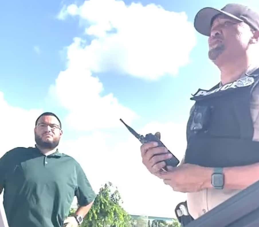 Kevin was asked to step out of the car and hand over his license (Screenshot/Kevin Enciso)