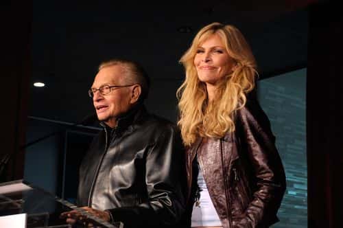 Broadcaster Larry King speaks to the audience as wife Shawn look son at the 