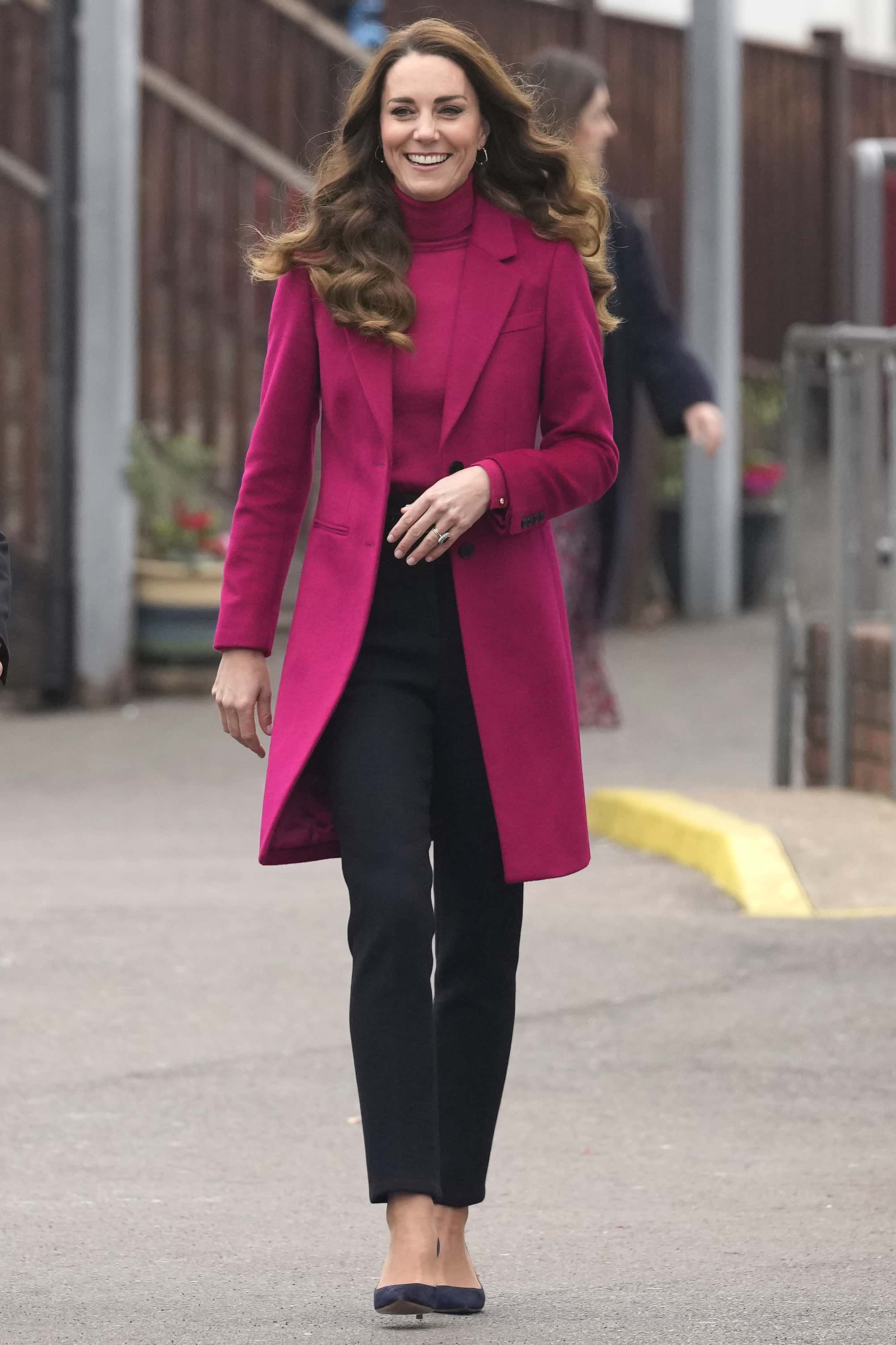 Britain's Catherine, Duchess of Cambridge smiles as she arrives for a visit to Nower Hill High School on November 24, 2021 in London, England. During the visit the Duchess joined a science lesson studying neuroscience and the importance of early childhood development.