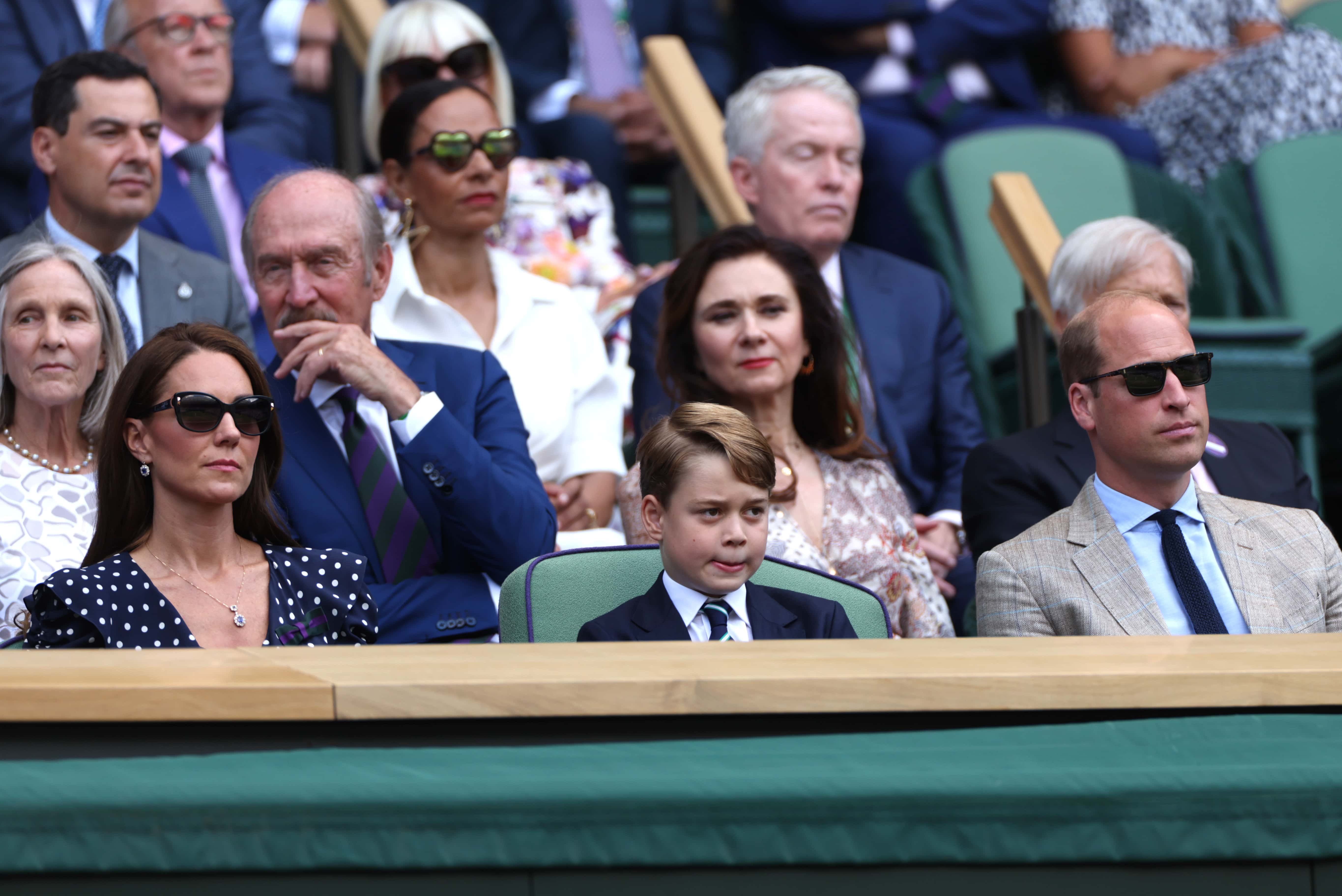 (L-R) Catherine, Duchess of Cambridge, Prince George of Cambridge and Prince William, Duke of Cambridge are seen in the Royal Box watching Novak Djokovic of Serbia play Nick Kyrgios of Australia during their Men's Singles Final match on day fourteen of The Championships Wimbledon 2022 at All England Lawn Tennis and Croquet Club on July 10, 2022 in London, England. (Photo by Clive Brunskill/Getty Images)