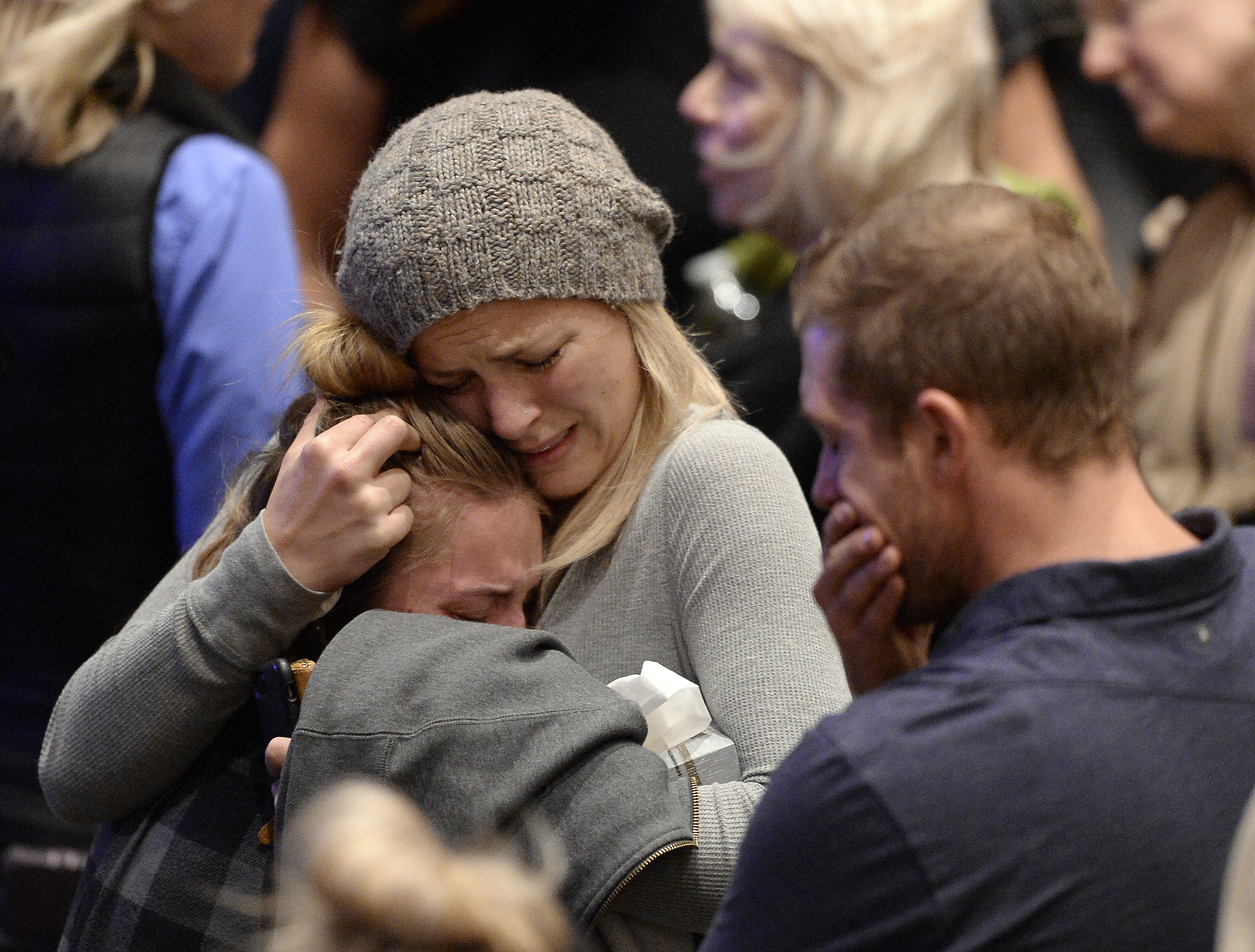 Mourners cry and comfort each other during a vigil for the victims of the mass shooting at the Thousand Oaks Civic Arts Plaza on November 8, 2018, in Thousand Oaks, California. Twelve people including a Ventura County Sheriff sergeant and the gunman died in the mass shooting at Borderline Bar and Grill. (Getty)