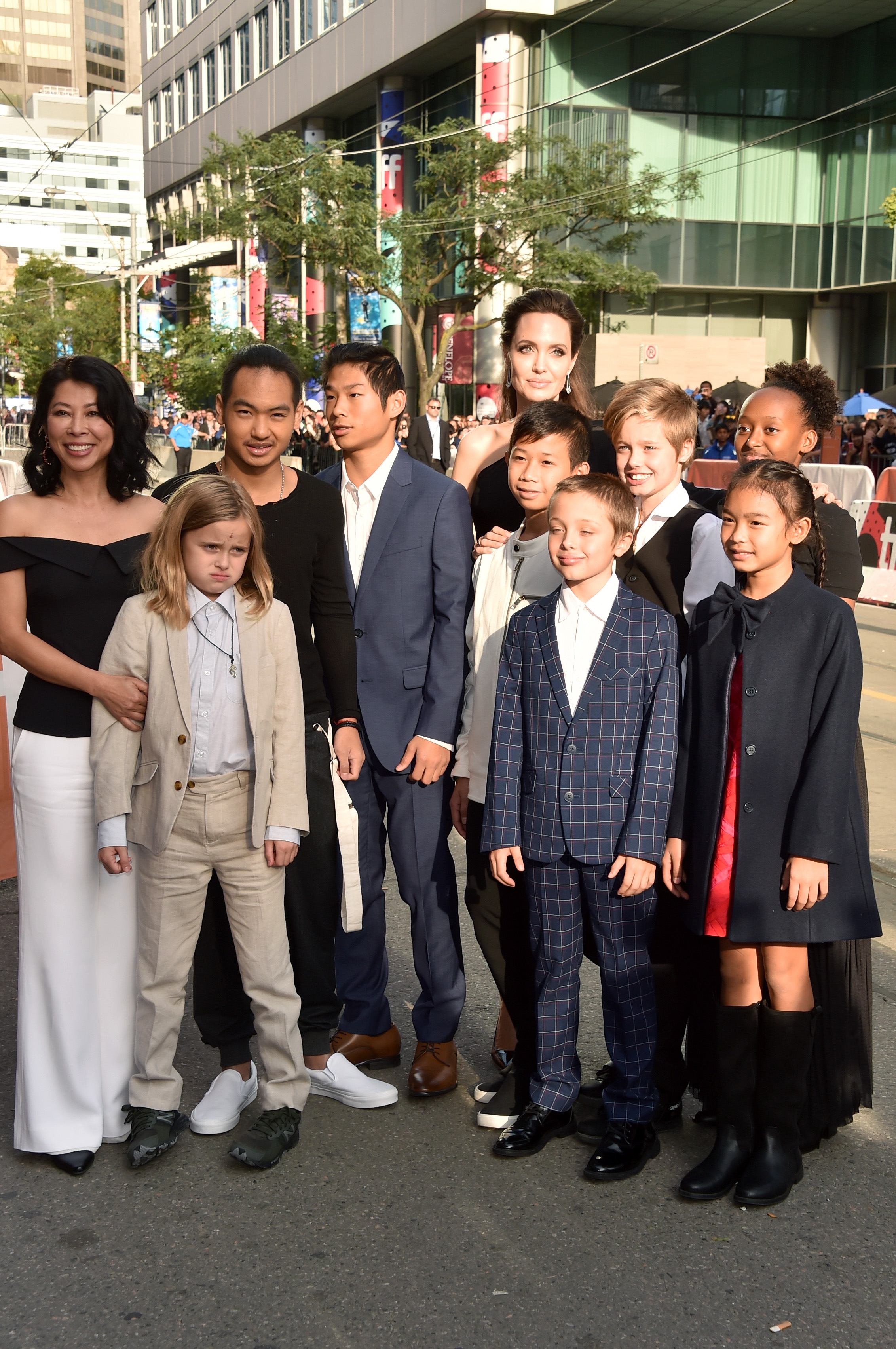 (L-R) Loung Ung, Vivienne Jolie-Pitt, Maddox Jolie-Pitt, Pax Jolie-Pitt, Angelina Jolie, Kimhak Mun, Knox Jolie-Pitt, Shiloh Jolie-Pitt, Zahara Jolie-Pitt and Sareum Srey Moch attend the 'First They Killed My Father' premiere during the 2017 Toronto International Film Festival at Princess of Wales Theatre on September 11, 2017 in Toronto, Canada.