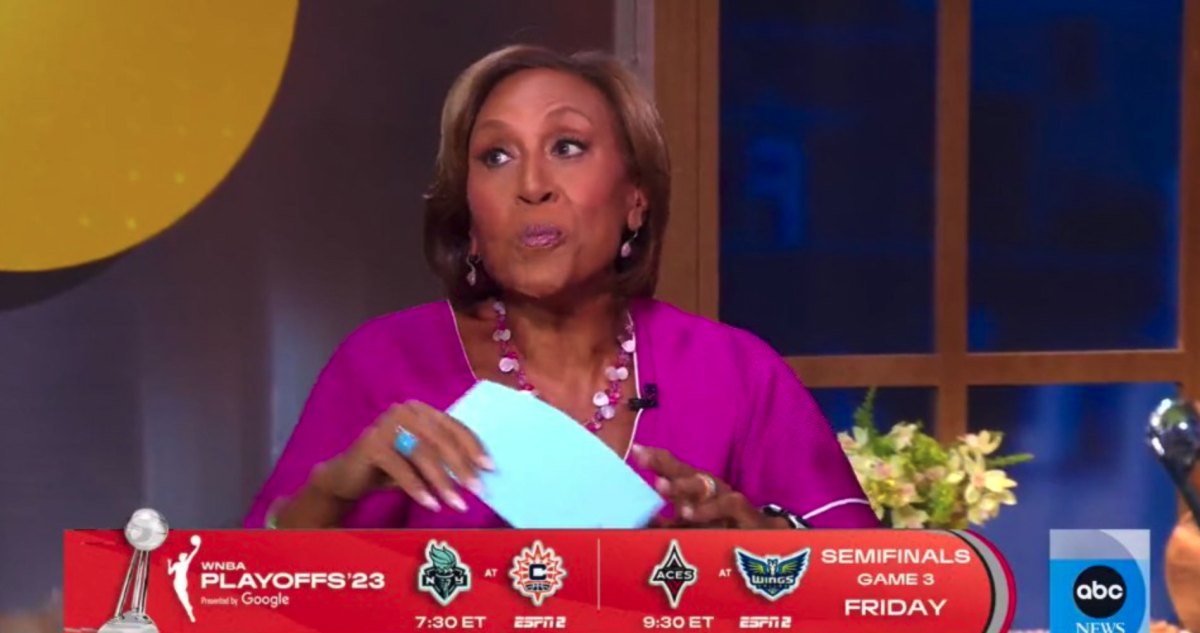 Michael Strahan posted Robin Roberts up, which in basketball terms means blocking her from getting the ball (ABC)