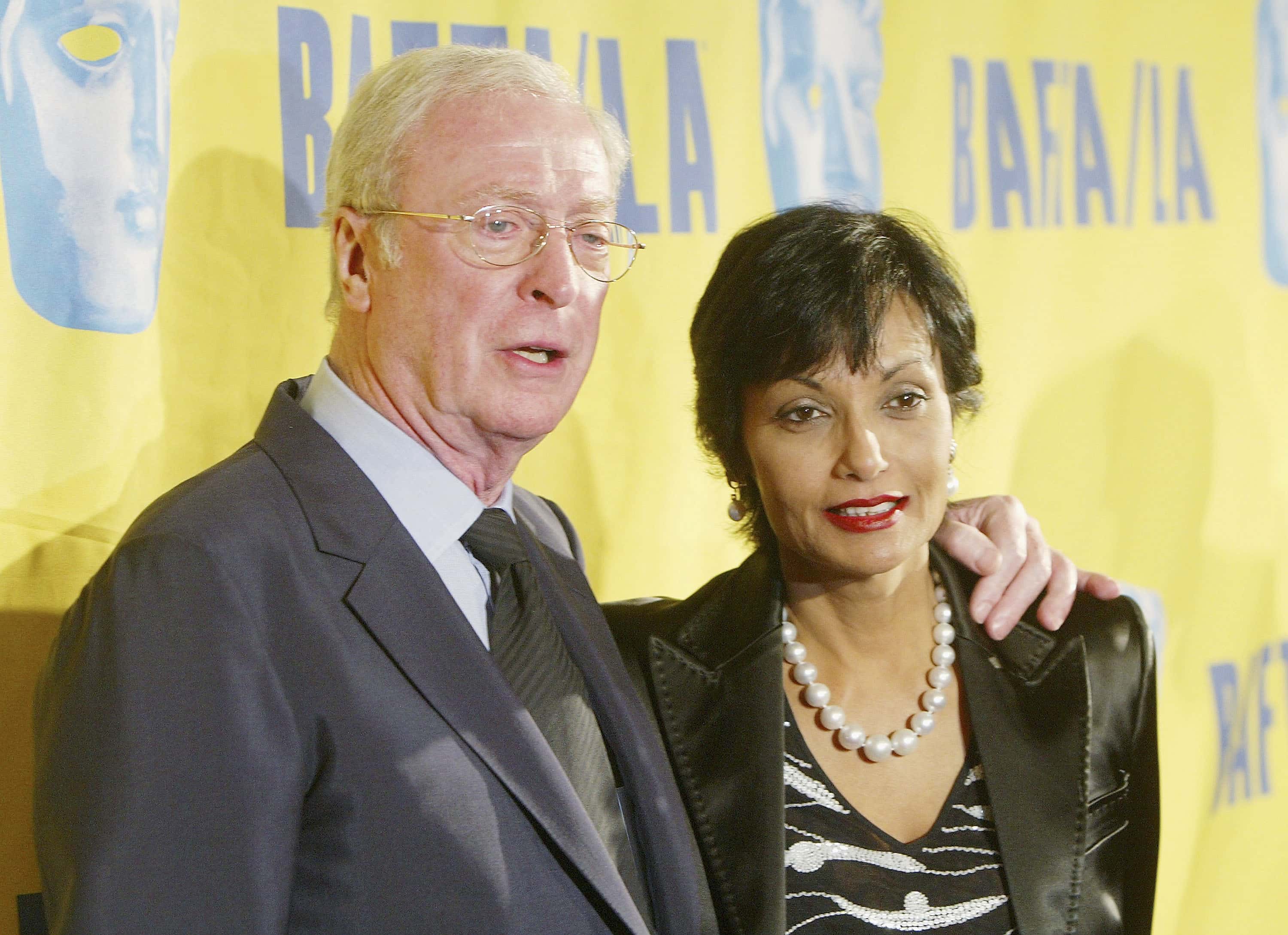 Actor Sir Michael Caine and wife Shakira arrive at the 13th Annual BAFTA/LA Britannia Awards at the Beverly Hilton Hotel on November 4, 2004, in Beverly Hills, California. (Photo by Kevin Winter/Getty Images)