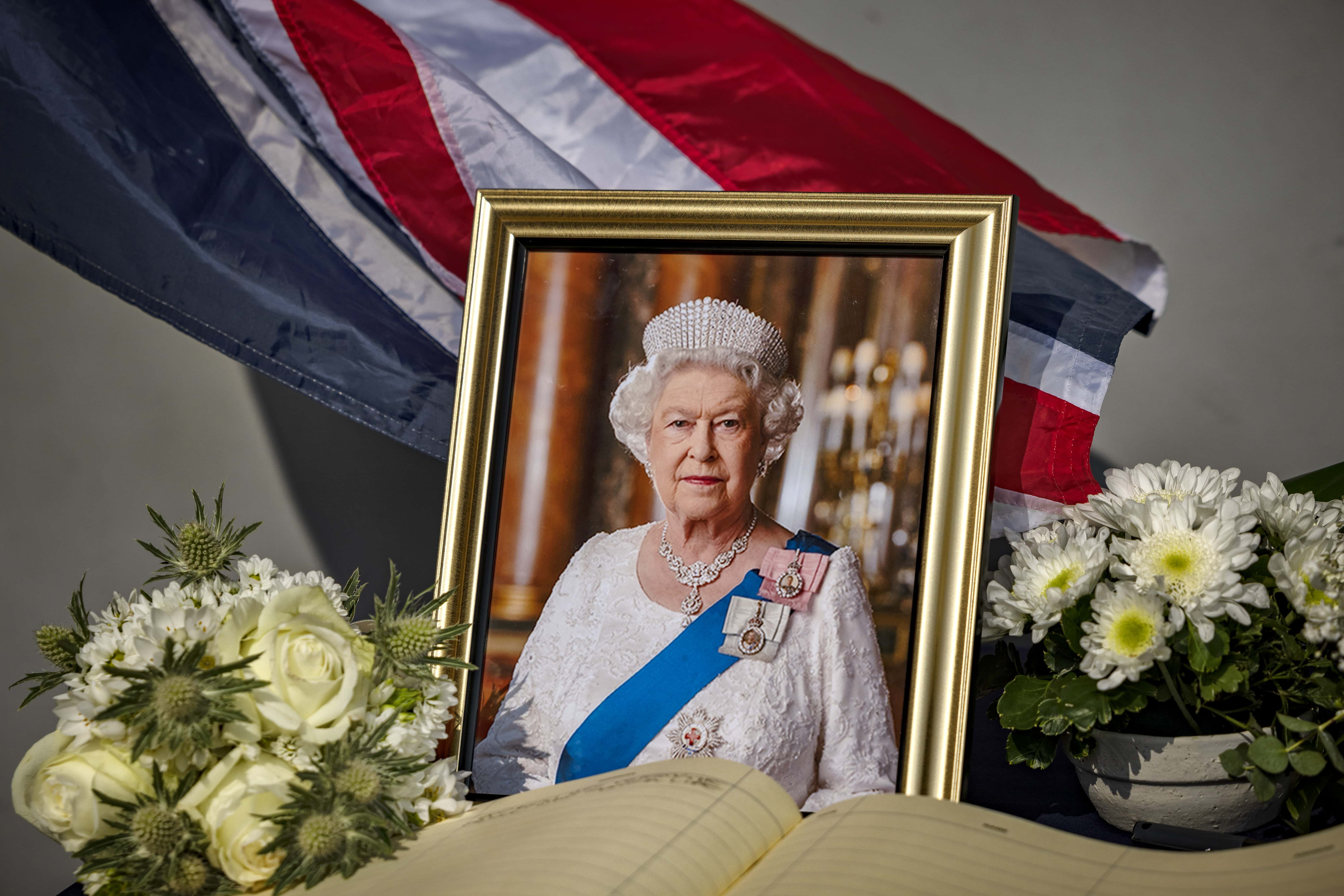 A picture of Queen Elizabeth II is seen at a memorial at the British Embassy on September 09, 2022 in Manila, Philippines. Queen Elizabeth II, the UK's longest-serving monarch, has died at Balmoral aged 96, after reigning for 70 years. (Photo by Ezra Acayan/Getty Images)