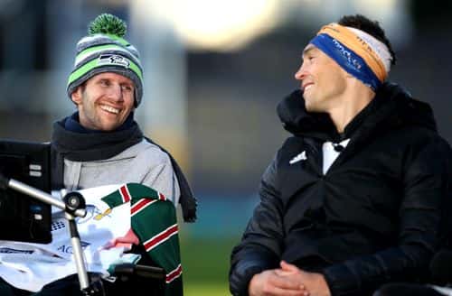 Ex-Leeds Rhinos rugby league player Kevin Sinfield (R) speaks with former teammate Rob Burrow after completing his Extra Mile Challenge at Emerald Headingley Stadium on November 23, 2021 in Leeds, England. Sinfield aims to run 101 miles in 24 hours in aid of motor neurone disease research.