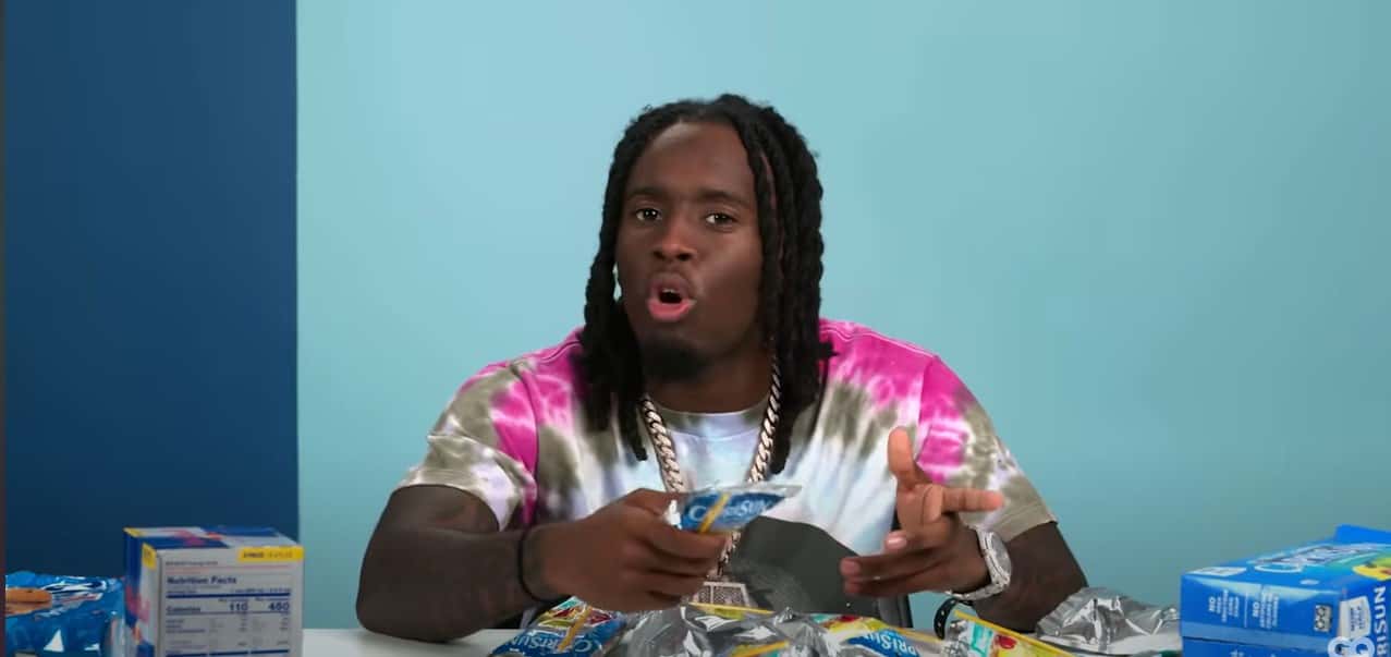 Kai Cenat presenting his favorite snacks (GQ/YouTube)