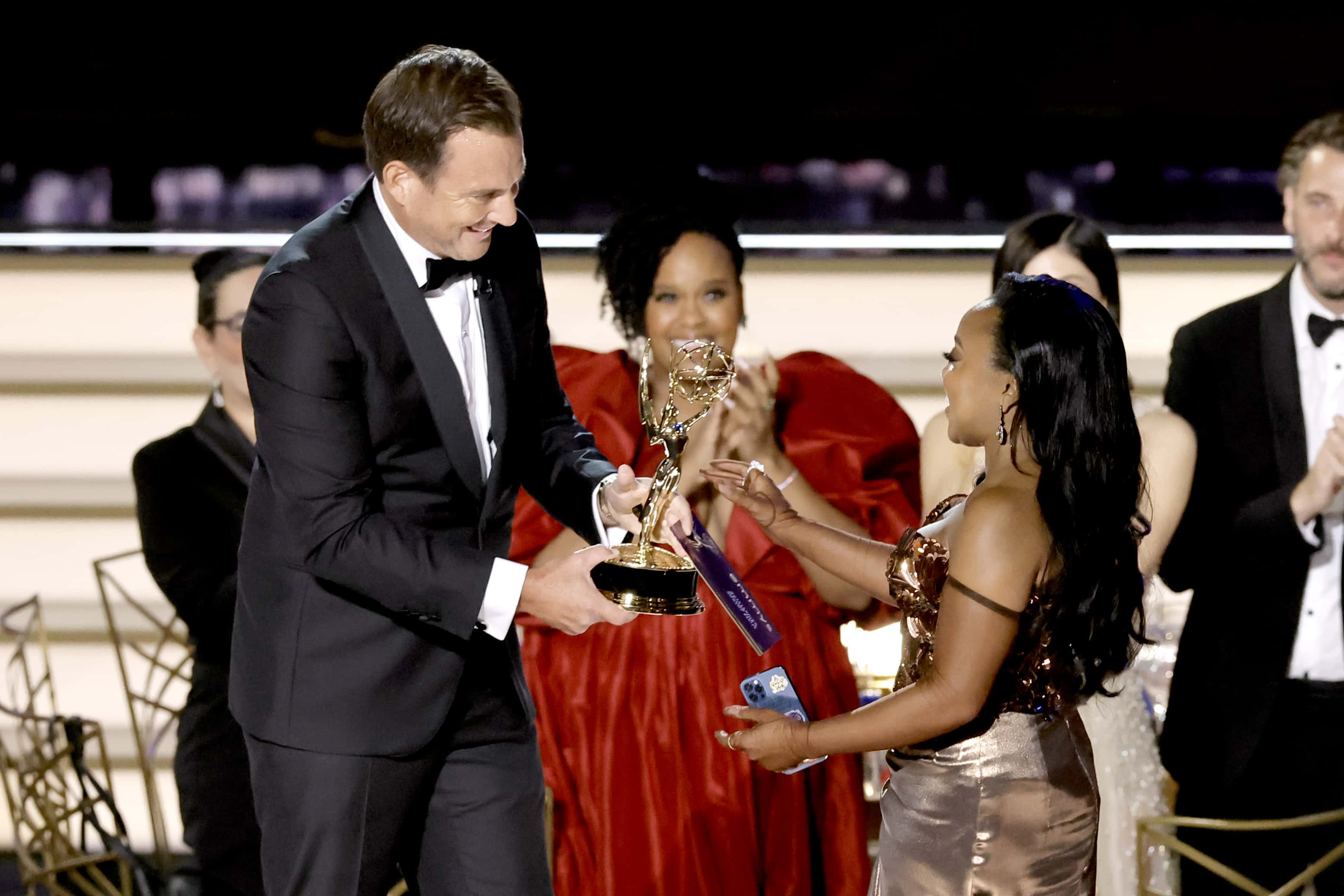 LOS ANGELES, CALIFORNIA - SEPTEMBER 12: Quinta Brunson (R) accepts Outstanding Writing for a Comedy 
