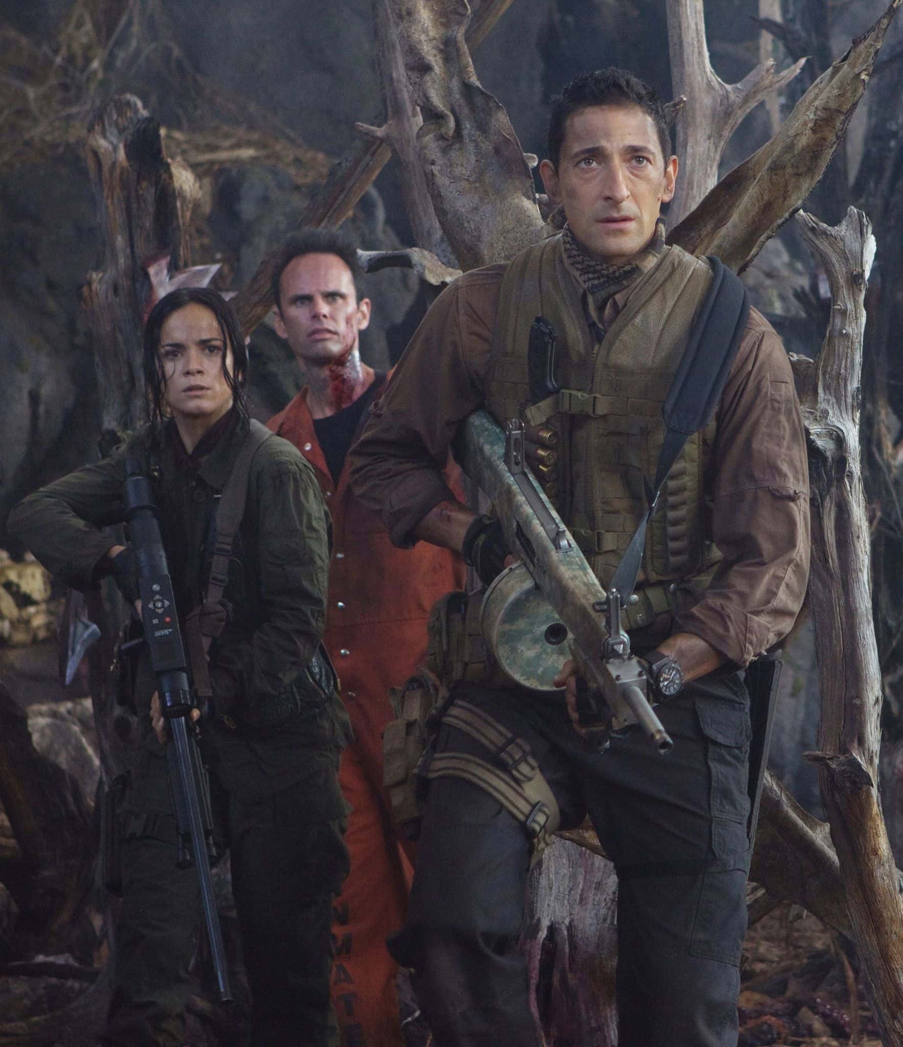 Adrien Brody (Royce), Alice Braga (Isabelle), and Walton Goggins (Stans) in 'Predators' (20th Century Studios)